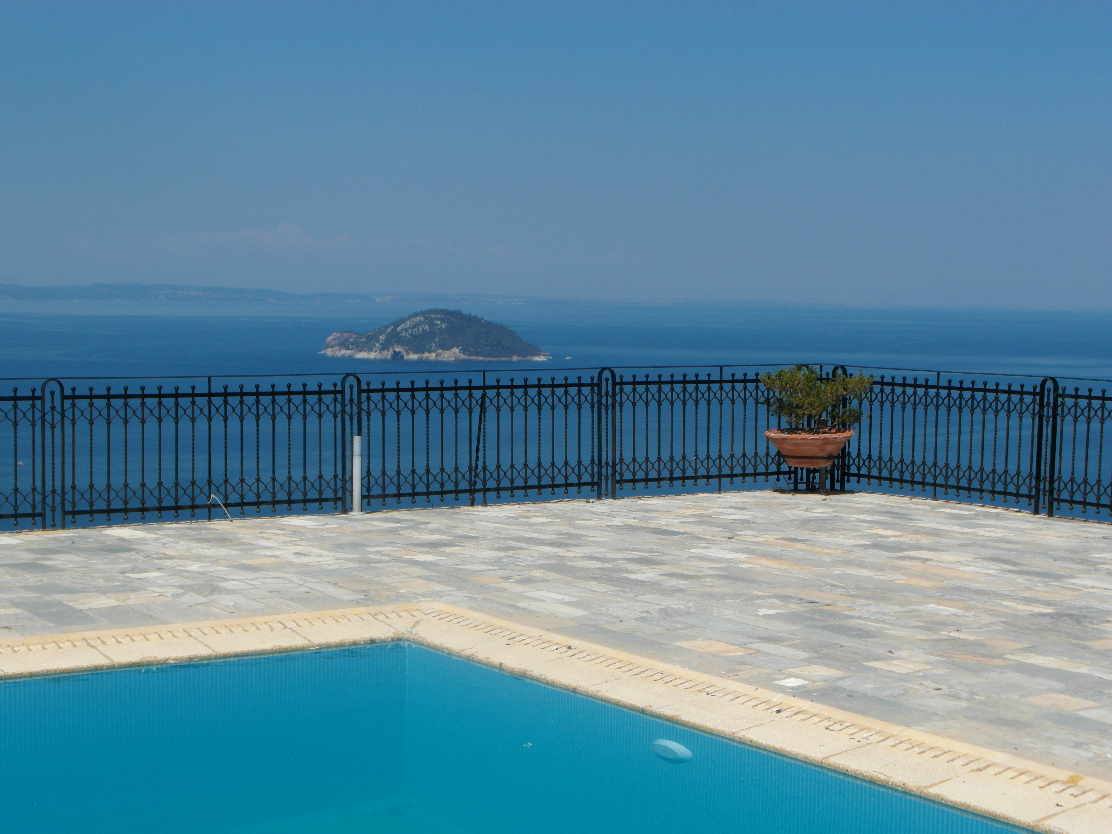 View of Turtle Island from the pool terrace at Villa Galini